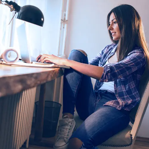Woman opening IRA using laptop