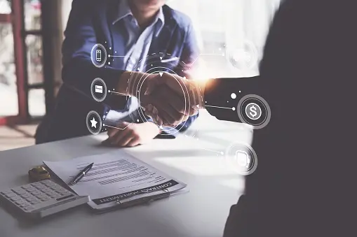 photo of people shaking hands