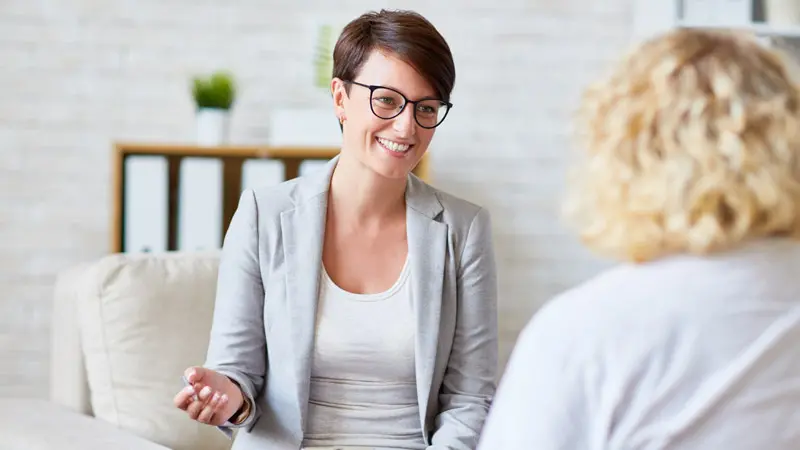 Two women reviewing investment options