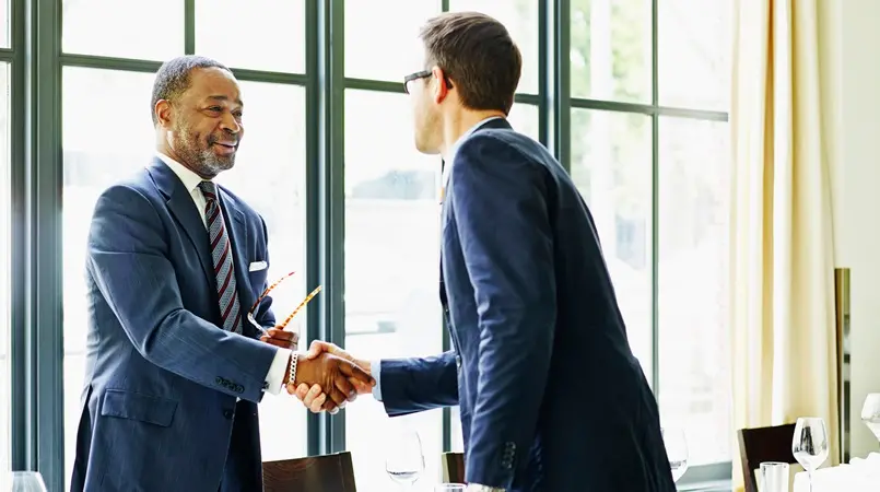 Two buisiness men discussing borderless banking