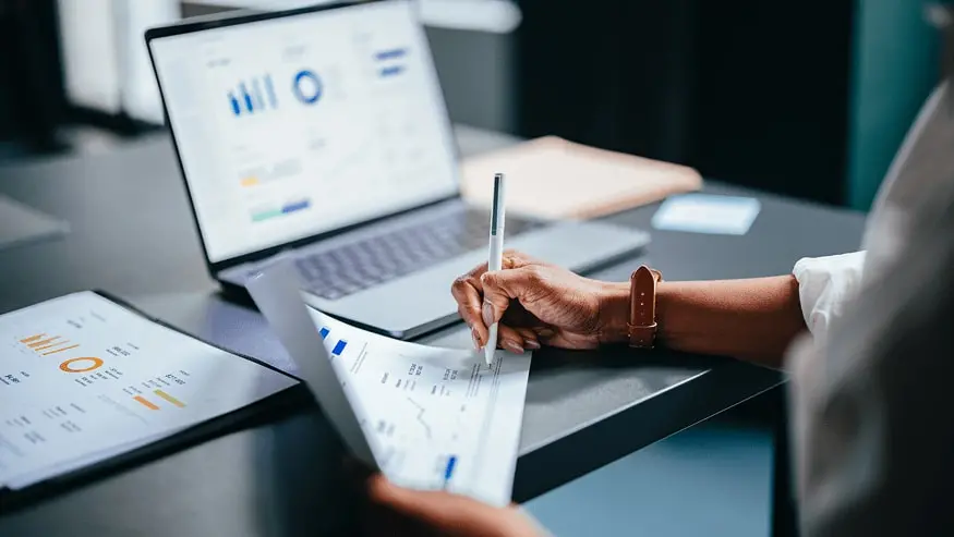 Laptop being used to display executive reporting and a commercial market report