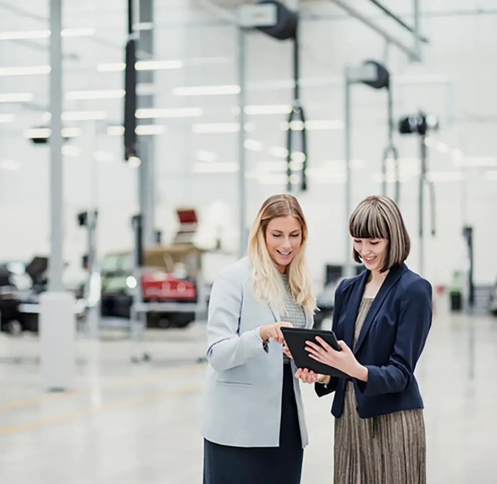 Two businesswomen looking at a tablet